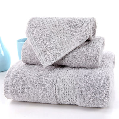 Absorbierendes Haushaltshandtuch aus reiner Baumwolle Drei-Stücke-Set mit beige Raster und feste Farbe